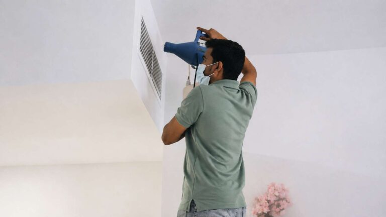 A mold cleaning expert is cleaning AC vents
