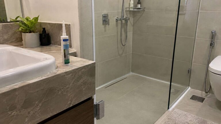 Mold-resistant sanitary silicone sealing a clean shower joint in a UAE bathroom